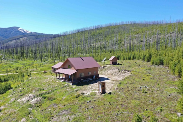 532 Warren Creek Rd, Warren, ID 83671 - aerial view of property and surrounding area featuring a heavily wooded area and a mountain backdrop