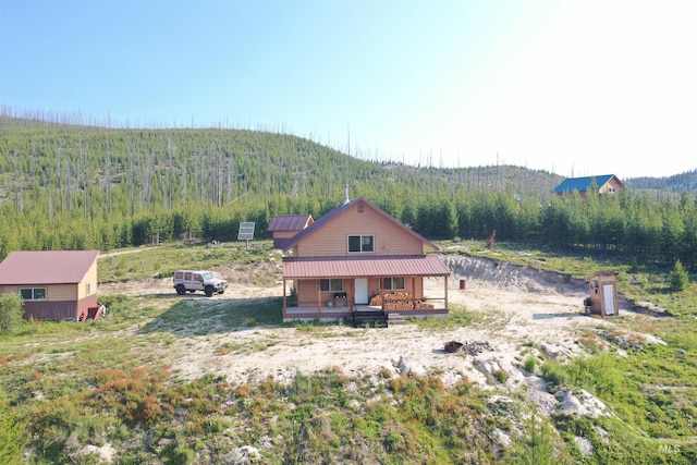 532 Warren Creek Rd, Warren, ID 83671 - exterior space featuring a forest view, covered porch, and a metal roof