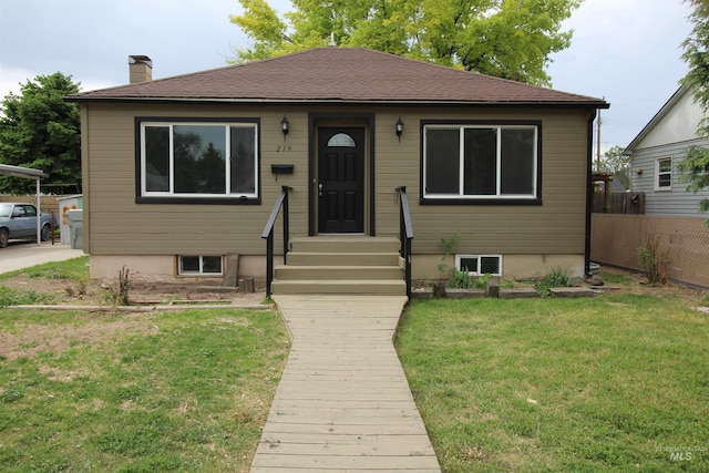 bungalow featuring a front yard