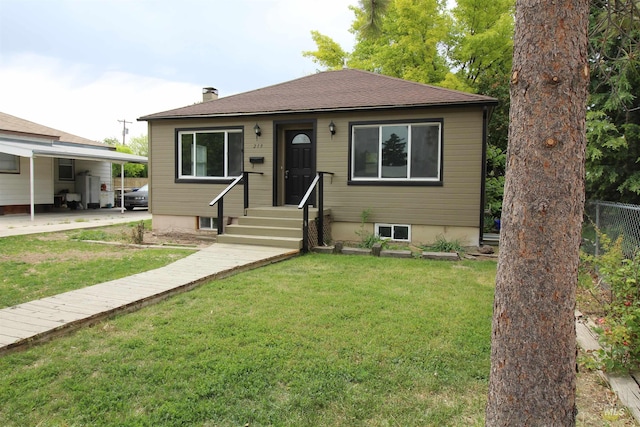 bungalow-style home featuring a front lawn