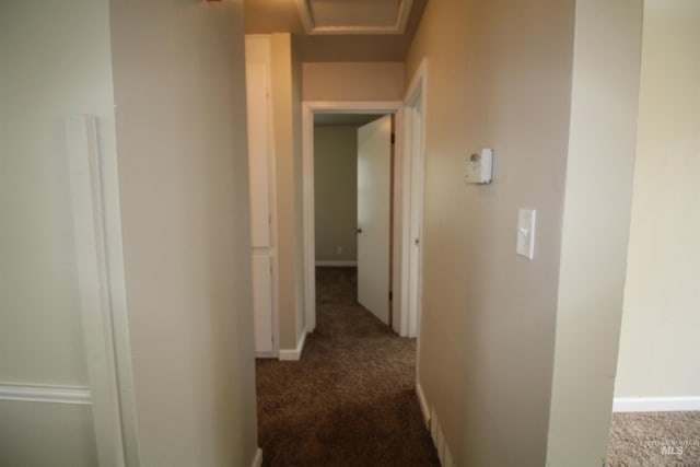 hallway with dark carpet