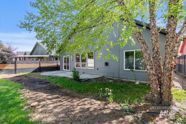 2249 N Eagle Creek Ln, Eagle, ID 83616 - rear view of property featuring fence and a patio area
