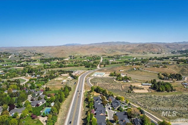 2249 N Eagle Creek Ln, Eagle, ID 83616 - aerial view of property and surrounding area with a mountainous background
