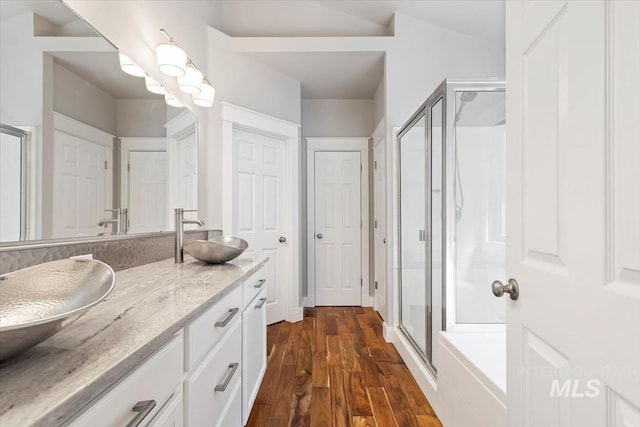 2249 N Eagle Creek Ln, Eagle, ID 83616 - bathroom with a shower stall, double vanity, and wood finished floors