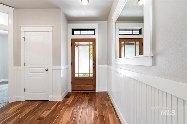 2249 N Eagle Creek Ln, Eagle, ID 83616 - foyer entrance with wainscoting and dark wood-type flooring
