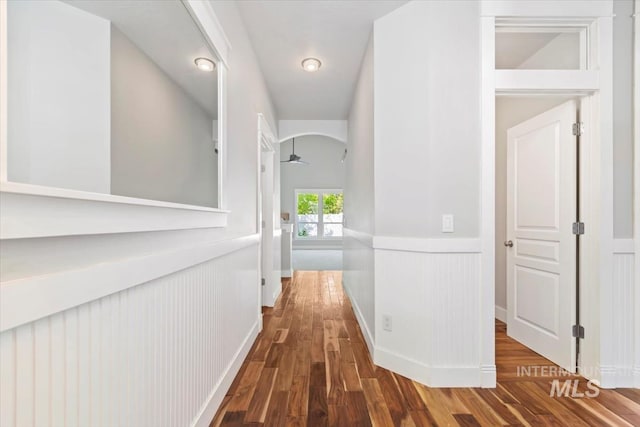 2249 N Eagle Creek Ln, Eagle, ID 83616 - hall with wainscoting, wood finished floors, and arched walkways
