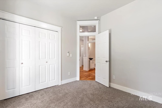 2249 N Eagle Creek Ln, Eagle, ID 83616 - unfurnished bedroom featuring carpet flooring, a closet, and baseboards