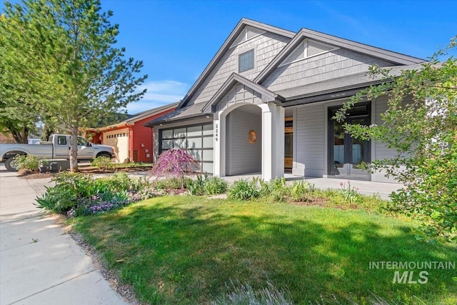 2249 N Eagle Creek Ln, Eagle, ID 83616 - view of front of property with a garage, a front yard, and covered porch