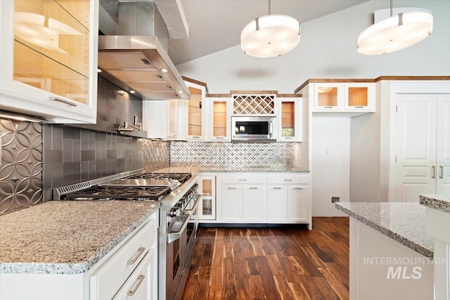2249 N Eagle Creek Ln, Eagle, ID 83616 - kitchen with appliances with stainless steel finishes, wall chimney exhaust hood, dark wood-style floors, decorative backsplash, and hanging light fixtures