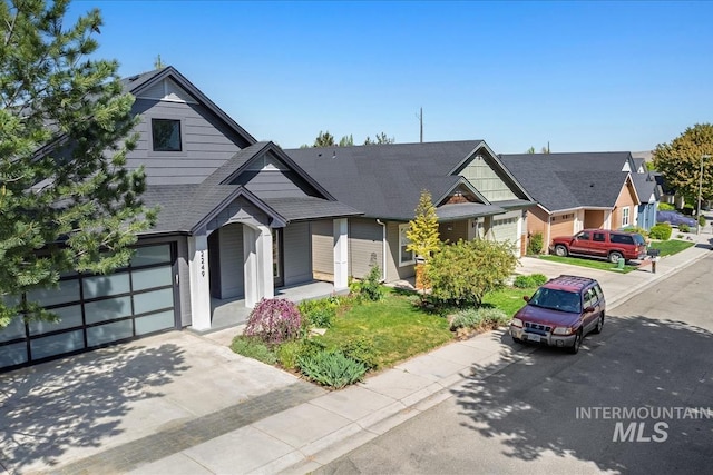 2249 N Eagle Creek Ln, Eagle, ID 83616 - view of front of home with driveway, a residential view, and an attached garage