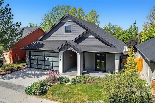 2249 N Eagle Creek Ln, Eagle, ID 83616 - view of front of property with driveway, a garage, french doors, and fence