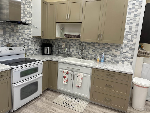 kitchen featuring backsplash, sink, wall chimney range hood, electric range, and light hardwood / wood-style floors