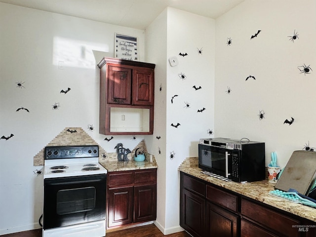 kitchen featuring light stone countertops, dark hardwood / wood-style floors, and white electric stove