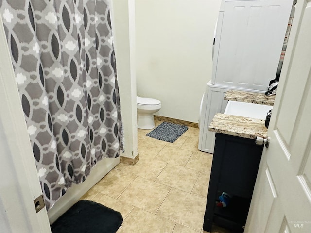 full bathroom featuring tile patterned flooring, vanity, shower / tub combo, and toilet