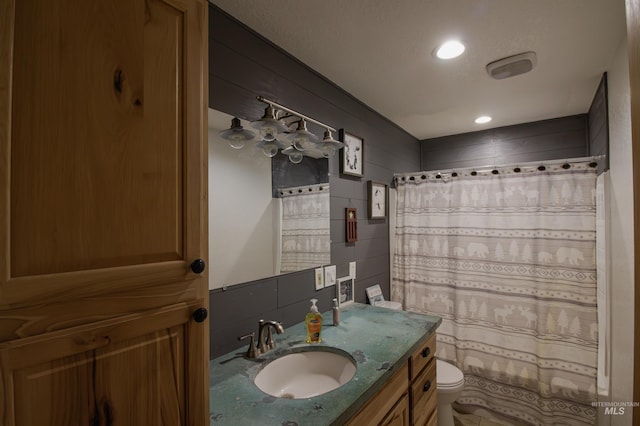full bathroom featuring backsplash, toilet, curtained shower, and vanity