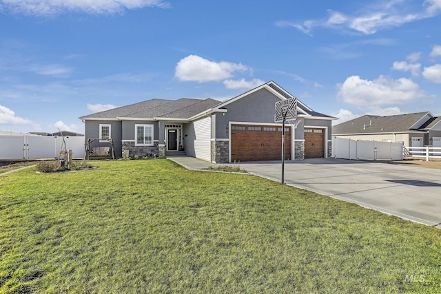 view of front of property featuring a garage and a front lawn