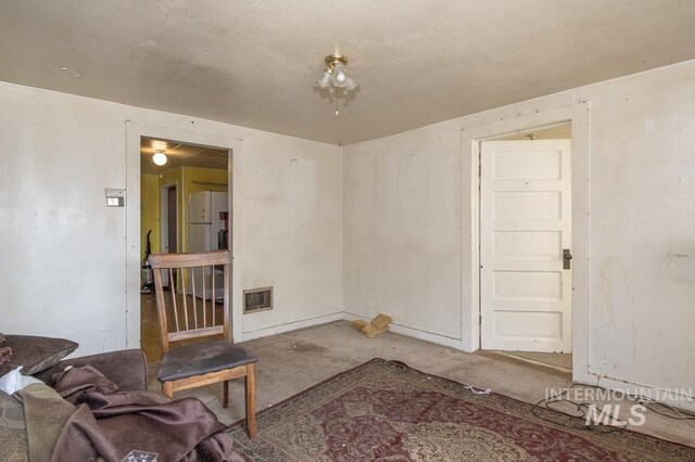 145 S 13th E, Mountain Home, ID 83647 - living room with carpet flooring and baseboards