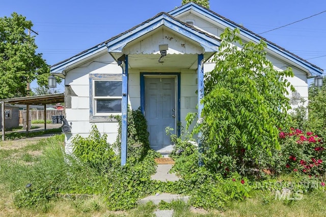 145 S 13th E, Mountain Home, ID 83647 - view of front facade with an attached carport