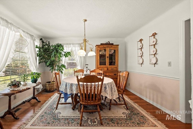 7425 Robinson Rd, Kuna, ID 83634 - dining space with wood finished floors and a textured ceiling
