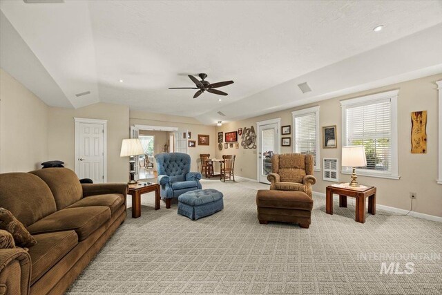 7425 Robinson Rd, Kuna, ID 83634 - living area with vaulted ceiling, light carpet, and a ceiling fan