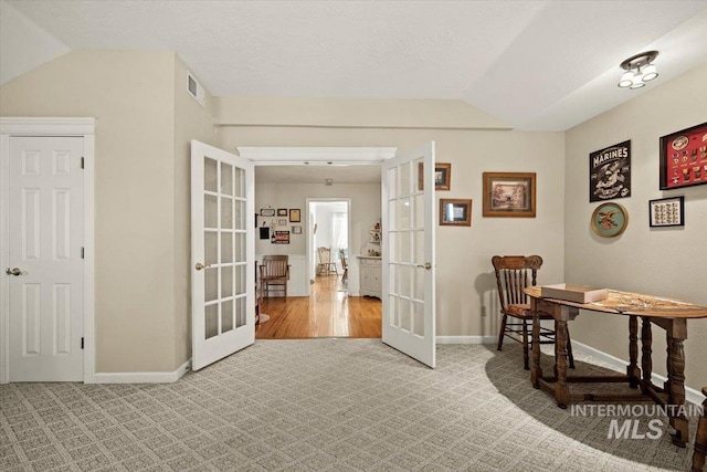 7425 Robinson Rd, Kuna, ID 83634 - carpeted home office with french doors and lofted ceiling