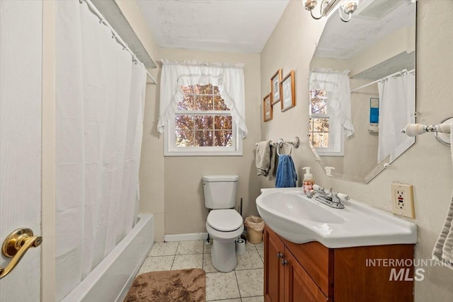 7425 Robinson Rd, Kuna, ID 83634 - full bathroom featuring vanity, tile patterned flooring, and shower / bath combo with shower curtain
