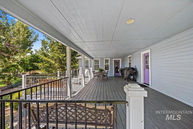 7425 Robinson Rd, Kuna, ID 83634 - wooden deck featuring outdoor dining area
