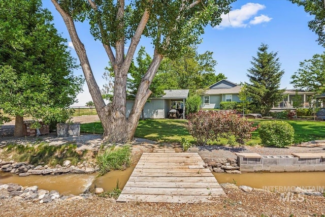7425 Robinson Rd, Kuna, ID 83634 - back of house featuring a lawn