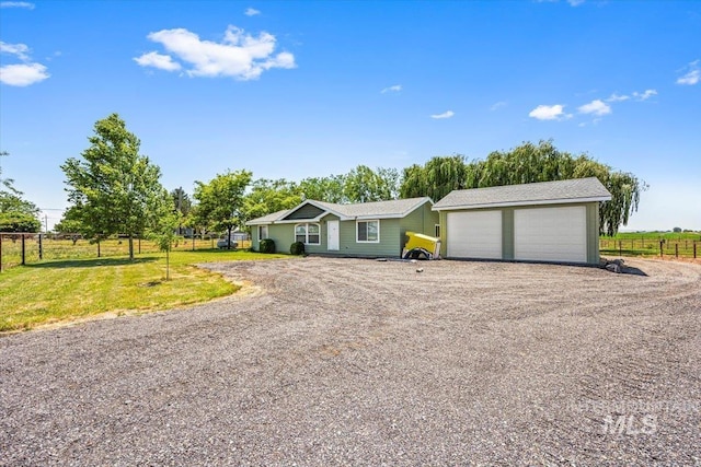 7425 Robinson Rd, Kuna, ID 83634 - ranch-style house featuring driveway and a garage