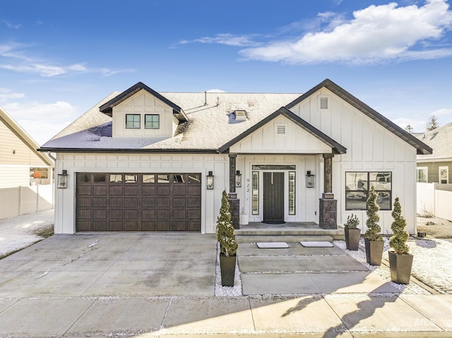922 Victory Dr, Gooding, ID 83330 - modern farmhouse style home with board and batten siding, concrete driveway, a garage, and fence