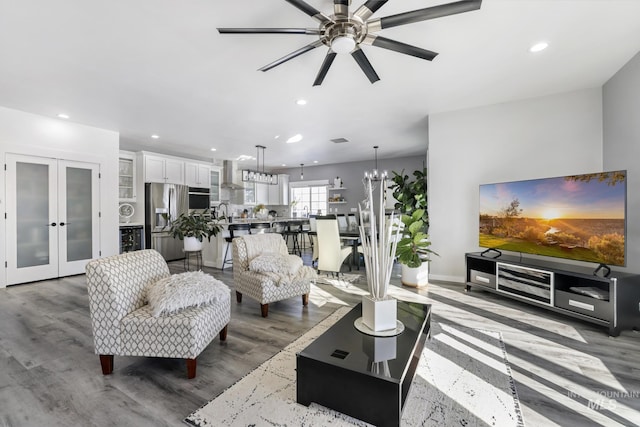 922 Victory Dr, Gooding, ID 83330 - living area featuring wood finished floors, recessed lighting, french doors, and ceiling fan