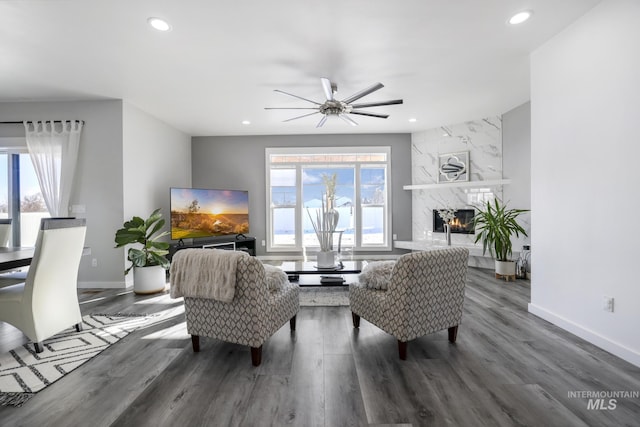 922 Victory Dr, Gooding, ID 83330 - living area featuring recessed lighting, a premium fireplace, wood finished floors, and a ceiling fan