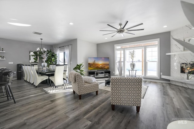 922 Victory Dr, Gooding, ID 83330 - living area featuring recessed lighting, visible vents, ceiling fan with notable chandelier, and dark wood-type flooring