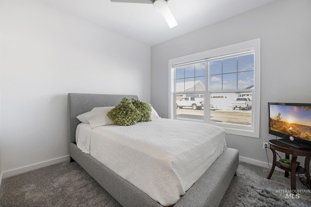 922 Victory Dr, Gooding, ID 83330 - bedroom with dark carpet, baseboards, and ceiling fan