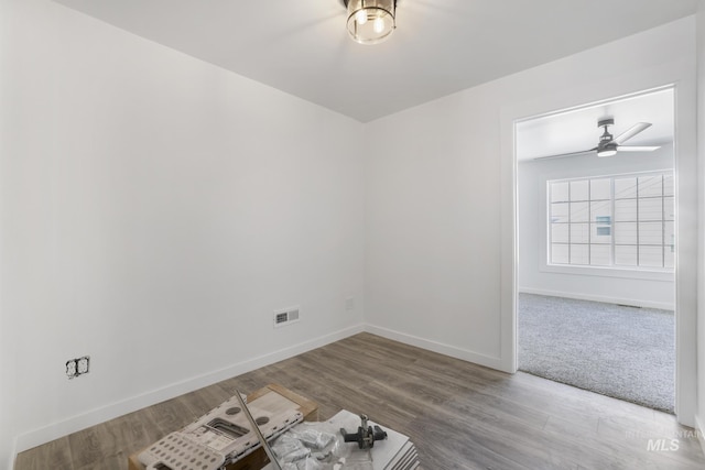 922 Victory Dr, Gooding, ID 83330 - unfurnished room featuring visible vents, baseboards, wood finished floors, and a ceiling fan