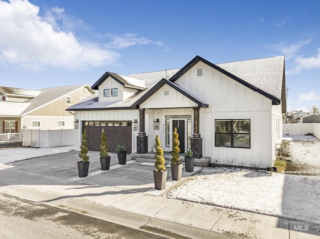 922 Victory Dr, Gooding, ID 83330 - modern inspired farmhouse with board and batten siding, concrete driveway, and fence