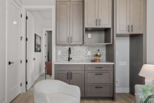 6920 N Spencer Way, Meridian, ID 83646 - kitchen featuring a sink, gray cabinetry, light wood finished floors, and light countertops
