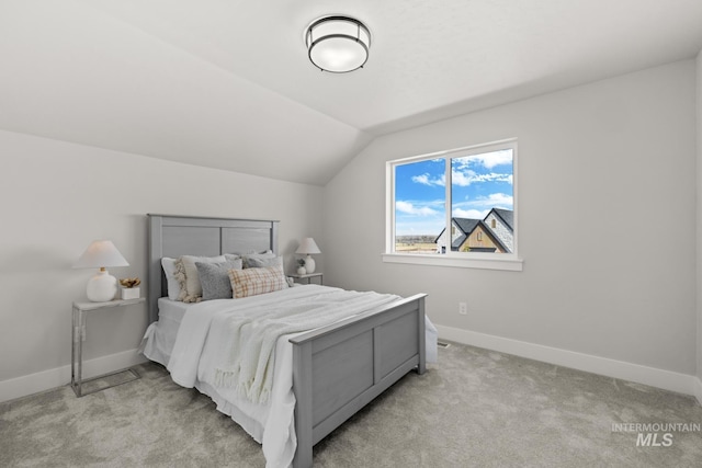 6920 N Spencer Way, Meridian, ID 83646 - bedroom with vaulted ceiling, light colored carpet, and baseboards