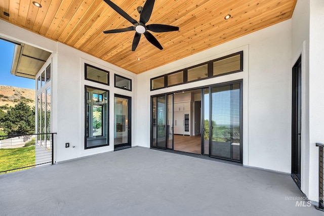 view of patio featuring ceiling fan