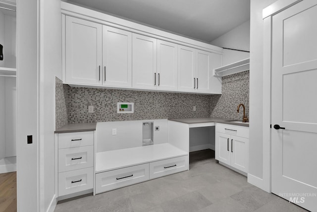 washroom featuring electric dryer hookup, cabinets, hookup for a washing machine, and sink