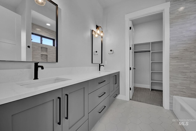 bathroom featuring vanity, independent shower and bath, and tile patterned flooring