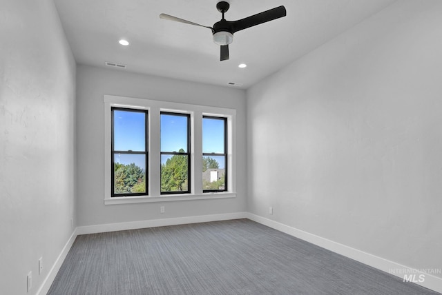 carpeted empty room featuring ceiling fan