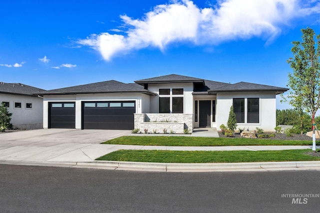 prairie-style home featuring a garage