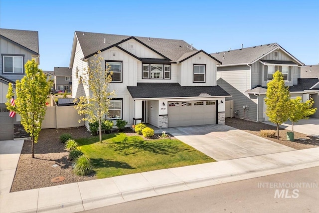 4447 W Everest St, Meridian, ID 83646 - view of front of house with fence, stone siding, board and batten siding, concrete driveway, and an attached garage