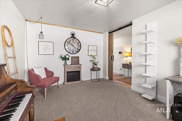 4447 W Everest St, Meridian, ID 83646 - living area featuring a fireplace, baseboards, and carpet