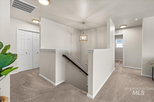 4447 W Everest St, Meridian, ID 83646 - staircase featuring carpet floors, baseboards, and visible vents