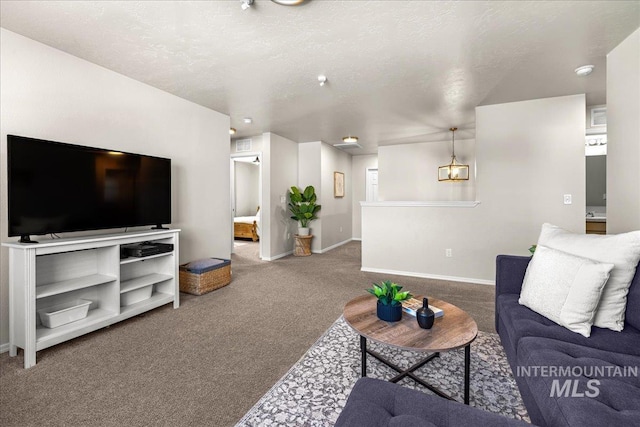 4447 W Everest St, Meridian, ID 83646 - carpeted living area with a textured ceiling and baseboards