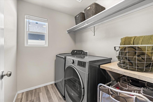 4447 W Everest St, Meridian, ID 83646 - washroom featuring laundry area, light wood-style flooring, independent washer and dryer, and baseboards