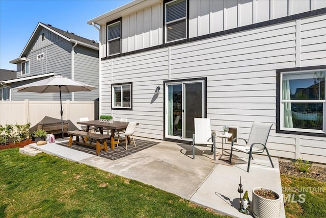 4447 W Everest St, Meridian, ID 83646 - rear view of property with fence, a patio, and board and batten siding