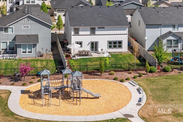 4447 W Everest St, Meridian, ID 83646 - rear view of property with a residential view, a playground, and a fenced backyard
